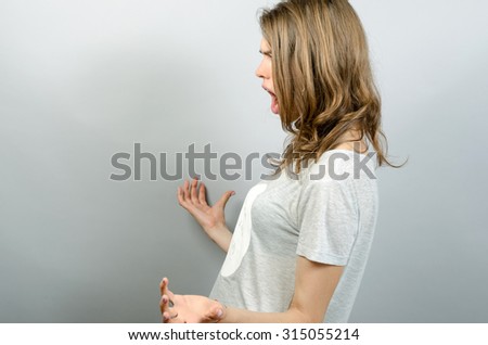 scared woman looking at something at screaming