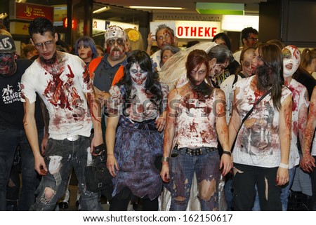 STUTTGART - OCTOBER 26: The Annual Zombie Walk Stuttgart People dress as Zombies and scare people in Stuttgart City. October 26, 2013 in Stuttgart, Germany.