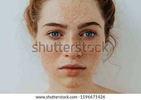 Similar – Image, Stock Photo Confident pensive freckled woman smoking on bed