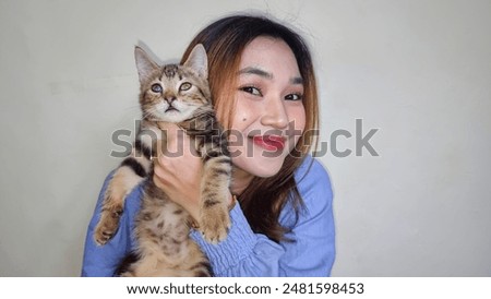 Similar – Image, Stock Photo Young woman hugging cat in hallway