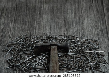 The old hammer and rusty nails