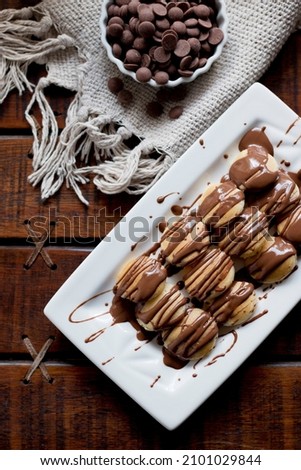 Similar – Image, Stock Photo Mini pancakes with butter and blueberries lie in a plate on a wooden table. Brunch, dessert for children, trending food. Space for text