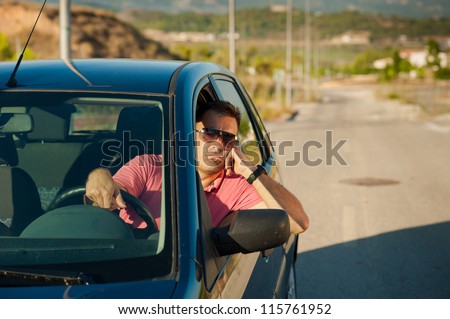 Guy pretty bored while waiting for an open road