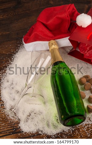 Christmas party still life around a bottle of champagne
