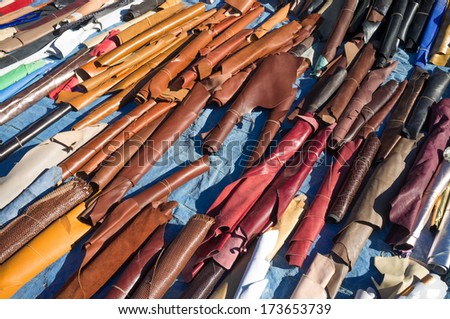 Leather scraps on display at a street market stall
