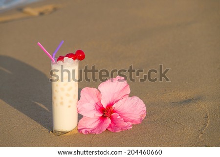 Horchata, a classic Spanish summer drink, served on a sunny beach