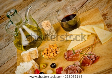 Spanish snacks displayed on a wooden board
