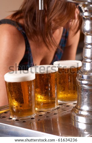 Draft pints ready to be served by the waitress