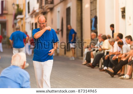 POLOP, SPAIN - OCT 4: Pelota players cheer at a winning point during the opening game of the pelota season on Oct 4, 2011 in Polop, Spain.