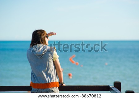 Teen looking out towards the horizon, a future concept