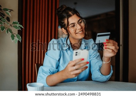 Similar – Image, Stock Photo A woman consumes a white line in powder form with a rolled banknote through her nose