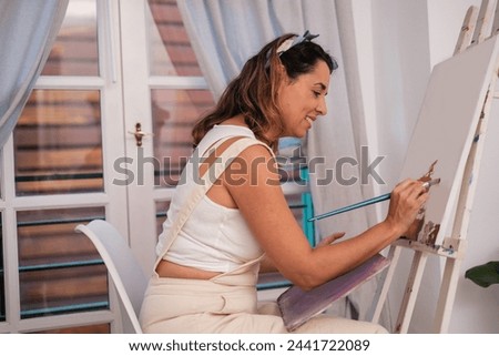 Similar – Image, Stock Photo Cheerful woman painting in workshop