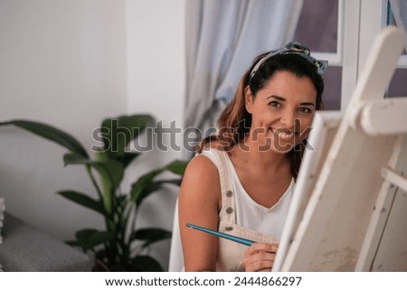 Similar – Image, Stock Photo Cheerful woman painting in workshop