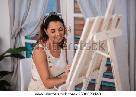 Similar – Image, Stock Photo Cheerful woman painting in workshop