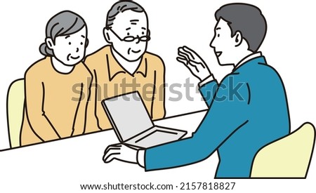 A businessman explaining to an elderly couple