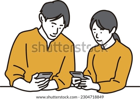 Asian man and woman exchanging contact information