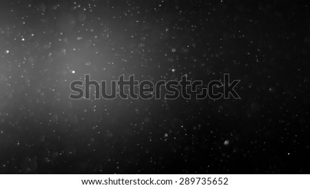 Particle dust floating for filter effect with a dark background.