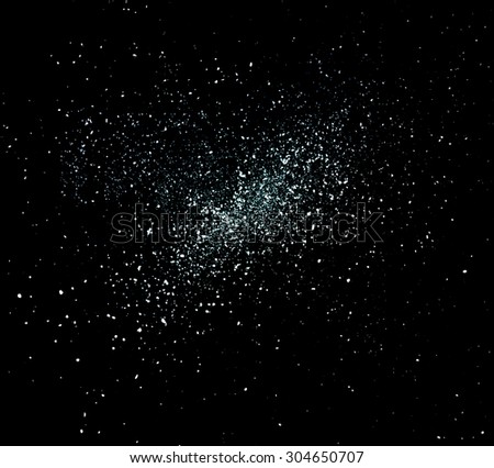 Dust particles and stars on a dark background.