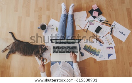 Photo of Working home concept - girl with smart phone, laptop and business reports.