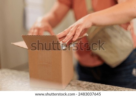 Similar – Image, Stock Photo Woman closing cardboard boxes with seal tape