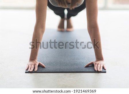 Similar – Image, Stock Photo Anonymous woman stretching body practicing yoga in revolved triangle pose