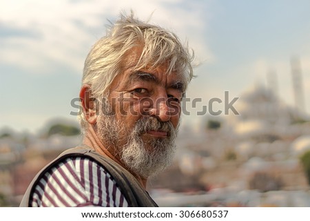 istanbul, Turkey, August 15, 2015: Old Man Fishing at Golden Horn With Mosque Background