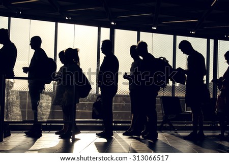 Istanbul, Turkey, August 27, 2015: People are waiting in the Ataturk airport terminal with their silhouette reverse lighted image