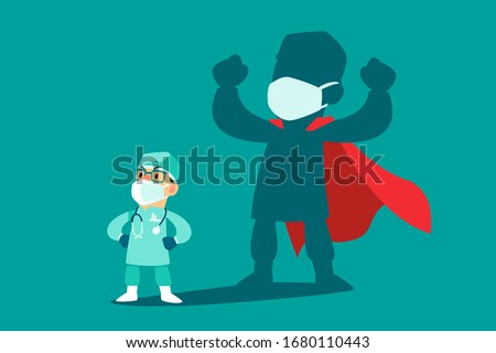 Brave doctor wearing medical mask and protection suit with his shadow as superhero. COVID-19 outbreak medical staff.