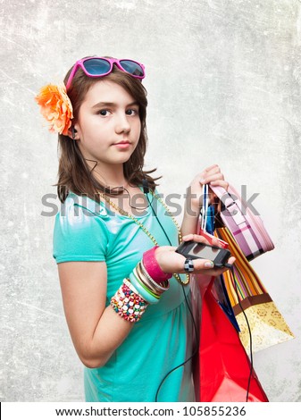Shopping. Shopping teen girl excited and wondered. Dynamic image of teen girl with shopping bags. Isolated on white background.
