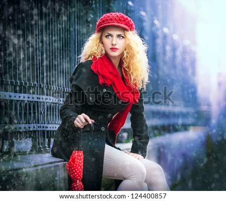attractive young woman in a winter fashion shot.Winter wild woman on snow.Winter Girl with beautiful make up, and snow flake.Portrait of attractive woman