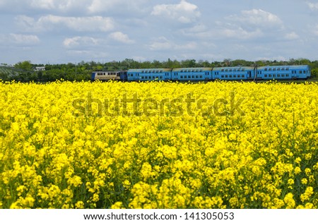 Similar – Image, Stock Photo Passenger train and rapeseed field. Spring landscape at sunrise