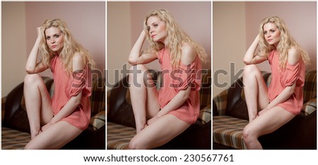 Young sensual woman sitting on sofa relaxing. Beautiful fair hair girl with comfortable clothes daydreaming on the couch, alone. Attractive blonde wearing only a red t-shirt in cozy scenery indoor