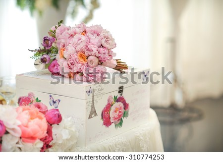 Wedding decoration on table. Floral arrangements and decoration. Arrangement of pink and white flowers in restaurant for luxury wedding event
