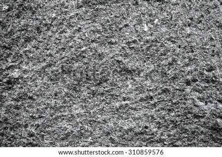 Grunge texture stone mountain background. Texture rough volcano rock background. Black and white color. Close up.