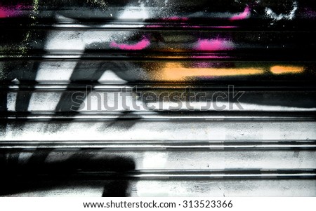 Abstract spray painting on metal door colorful wall background. Rustic and grunge texture urban. Many spray paint colors. Street and Fashion. Close up.