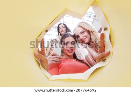 beautiful young women looking inside bag