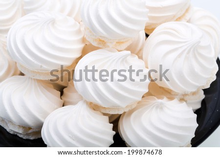 French vanilla meringue cookies on white background