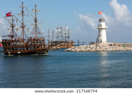 ALANYA, TURKEY - JUNE 13, 2014: Tourists enjoying sea journey on vintage sailships on june 13 2014 in Alanya, Turkey. Alanya is one of the most famous tourism industry centers in Turkey.