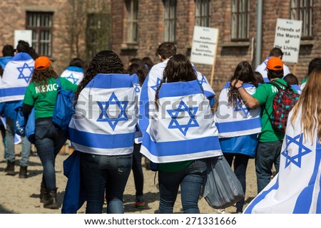 OSWIECIM, POLAND - APRIL 16, 2015: International Holocaust Remembrance Day.  People from the all the world meets on the March of the Living in german Concentration Camp in Auschwitz Birkenau.Poland