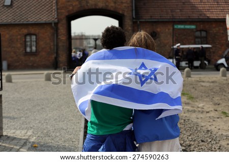 OSWIECIM, POLAND - APRIL 16, 2015: International Holocaust Remembrance Day . Annually people from the all the world meets on the March of the Living in german Concentration Camp in Auschwitz Birkenau.