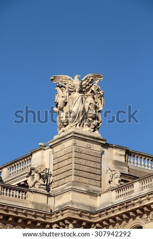 PARIS, FRANCE - SEPTEMBER 9, 2014: Paris -  Architectural fragments of Louvre building. Louvre Museum is one of the largest and most visited museums worldwide.