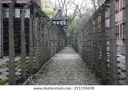 OSWIECIM, POLAND - APRIL 16, 2015: Electric fence in former Nazi concentration camp Auschwitz I, Poland