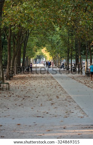 PARIS, FRANCE - SEPTEMBER 8 2014: People relax in Luxembourg Gardens in Paris, France. Luxembourg area is popular among tourists in Paris, the most visited city worldwide.