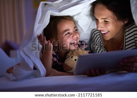 Similar – Image, Stock Photo girl reading her tablet or ebook in bed before sleeping