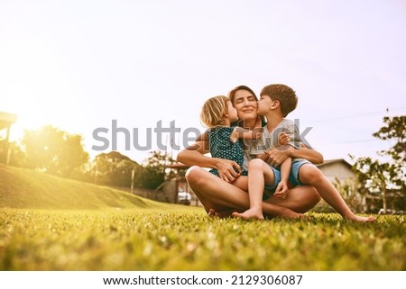 Image, Stock Photo Mother and daughter sit in the Lotus position in the garden. The family practices yoga outdoors. Back view, space for text