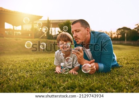 Similar – Foto Bild Getreidemann spielt mit Hund am Strand