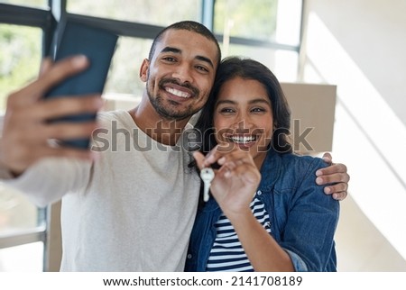 Similar – Image, Stock Photo Young couple taking a selfie while kissing in the mountains