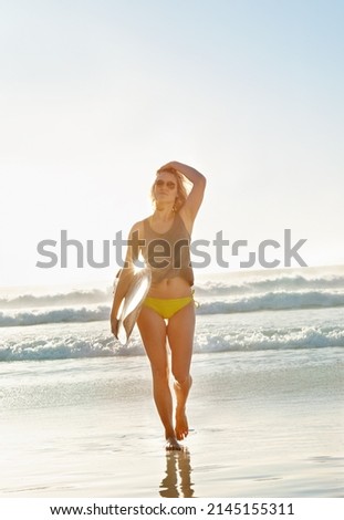 Image, Stock Photo Content female surfer walking on beach with surfboard