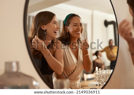 Similar – Image, Stock Photo Mirror image of two female legs and a hand with red nail polish in the mirror