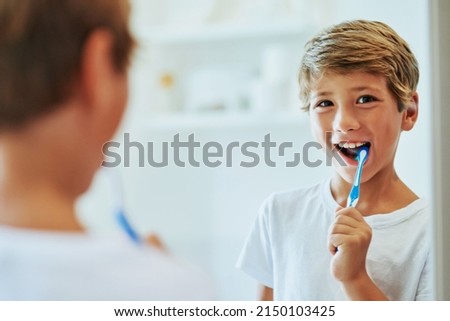 Similar – Image, Stock Photo Cute boy brushing teeth in cozy bathroom